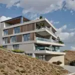 investment land in Tbilisi - Sunset render of apartment building with concrete facade in Tbilisi.