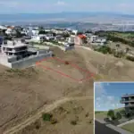 Tbilisi investment land with apartments project: Drone view of marked investment plot at Tabor Hill with proposed apartment building render – LD Estates real estate in Tbilisi, Georgia