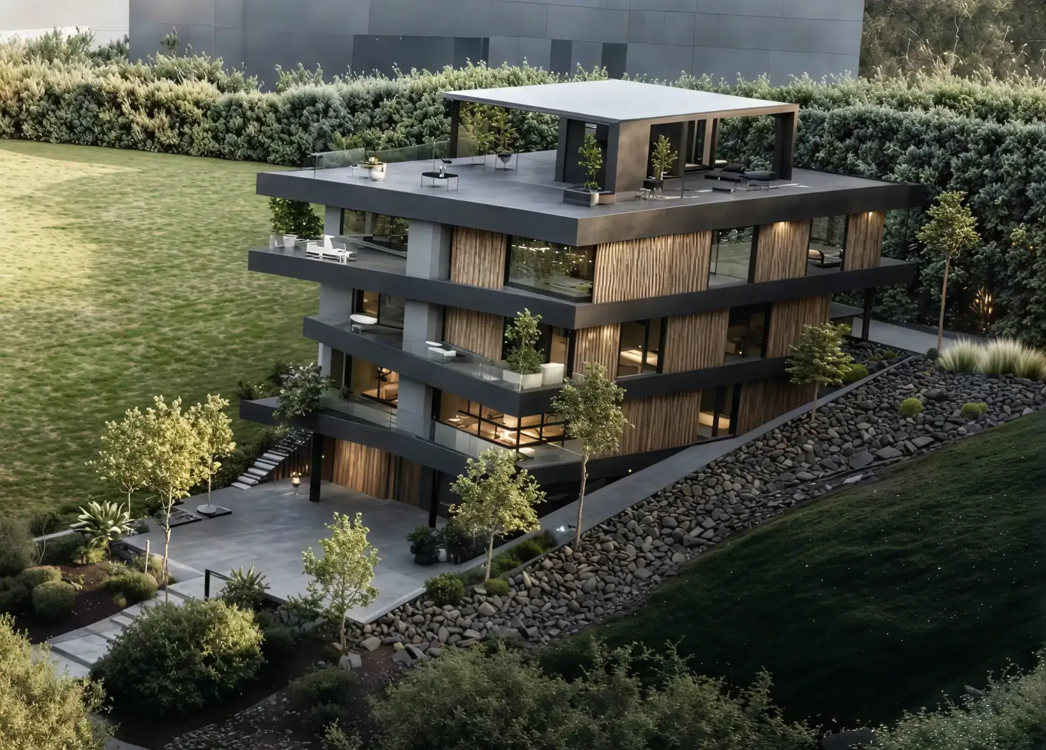 High-angle view of a modern apartment building with a Laminam facade and lush landscaping on a slope.
